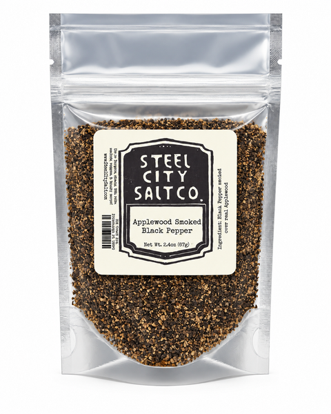 Steel City Salt Co. Applewood Smoked Black Pepper in a clear resealable stand-up pouch with a cream label, shown on a white background.