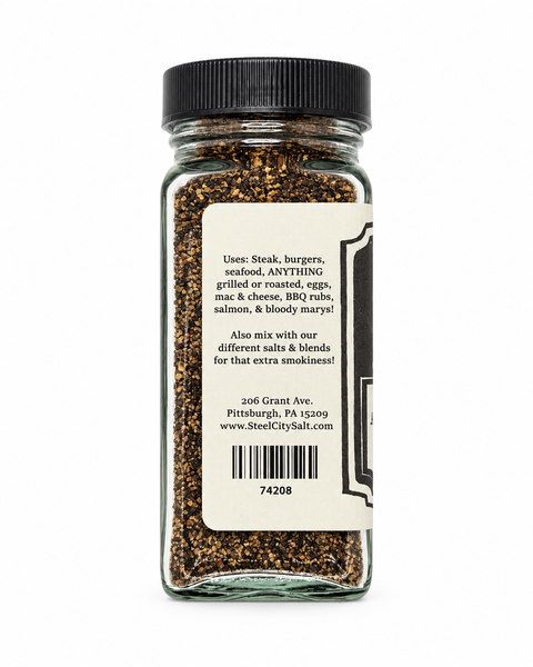 A clear glass spice jar with a black lid and a large cream label showing usage instructions, photographed on a white background.