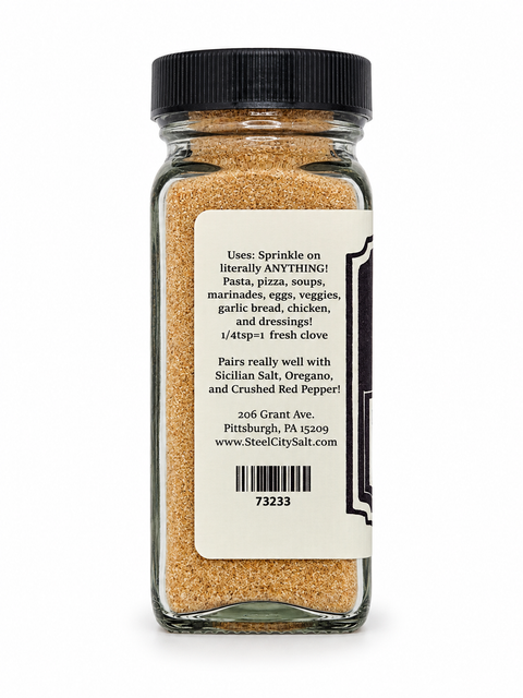 Steel City Salt black clove seasoning in a clear glass shaker bottle with a black cap, showing the back of the label with product description and barcode on a white background.