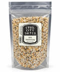 Steel City Salt Co. SFG Seasoning in a clear resealable stand-up pouch, showing a speckled seasoning mix of beige, brown, black, and white crystals.